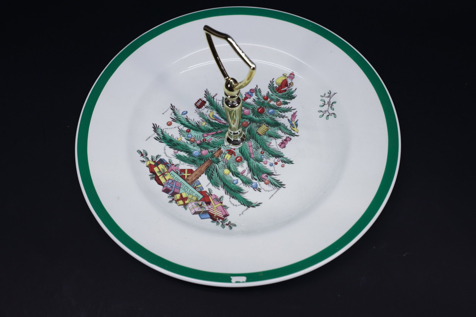 Spode Christmas Tree Handled Serving Plate: Description:A Spode "Christmas Tree" pattern serving plate, English earthenware marked "Spode, England, S3324 E, Christmas Tree" on the reverse, fitted with a gold-tone center handle for use as a