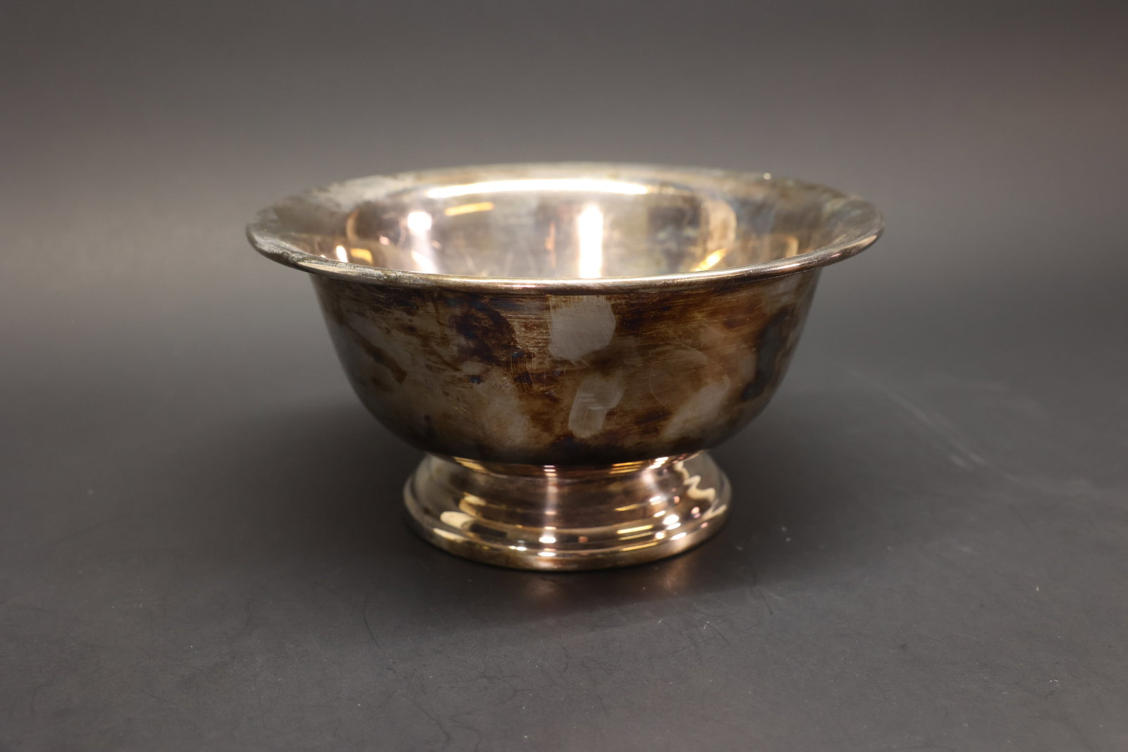 Poole Silver Co. Footed Bowl, Silver Plate: Round footed bowl in silver plate with a flared rim on a stepped pedestal foot. Marked "EPC, Poole Silver Co., Taunton, Mass., 502" on the underside.Dimensions: H: 4.25", W: 8.25"