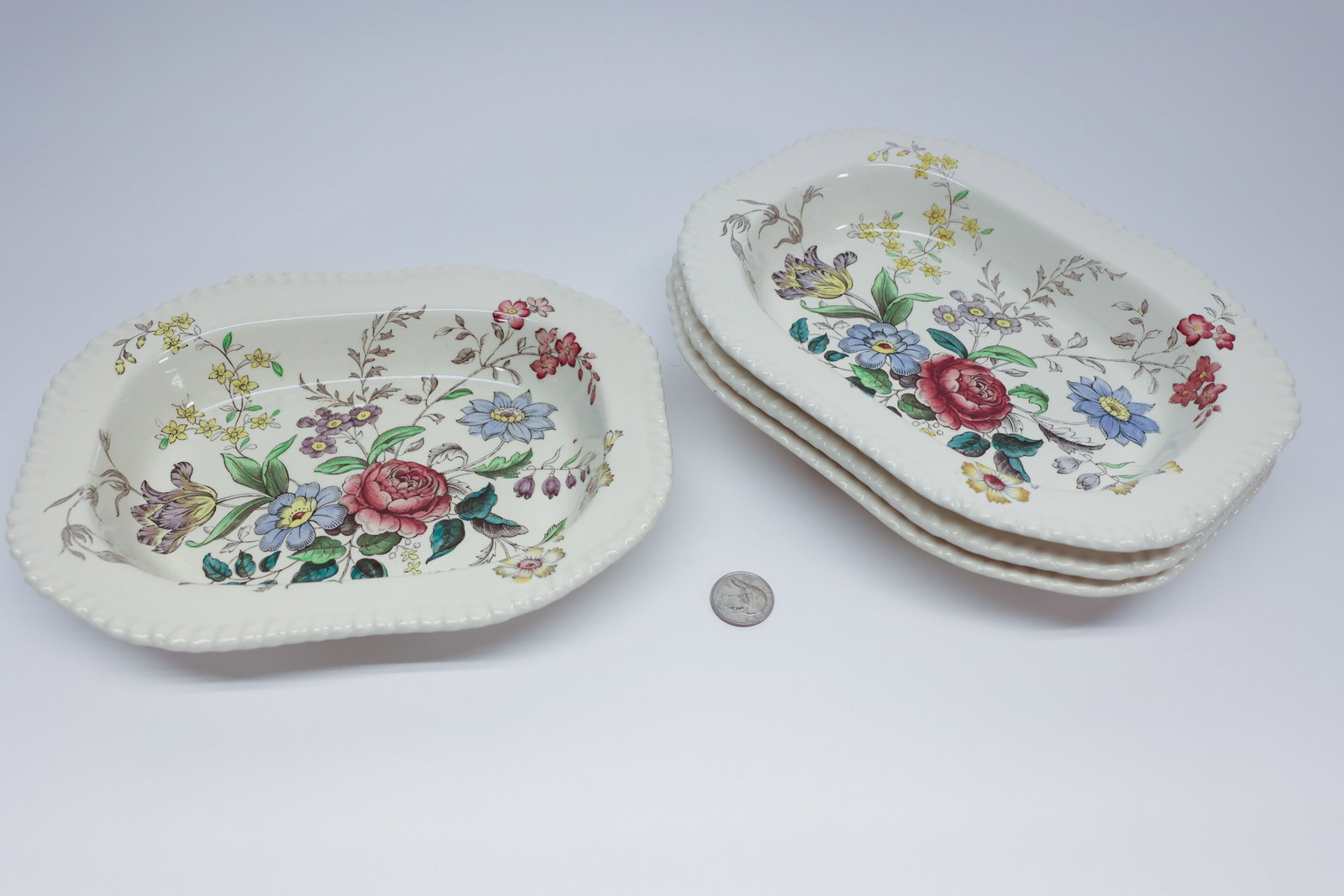Copeland Spode "Romney" Oval Vegetable Dishes (4): Set of four oval, deep-well earthenware serving dishes in Copeland Spode's "Romney" pattern, gadrooned rim with a polychrome transfer-printed floral bouquet spanning the interior. Base marked "Copelan