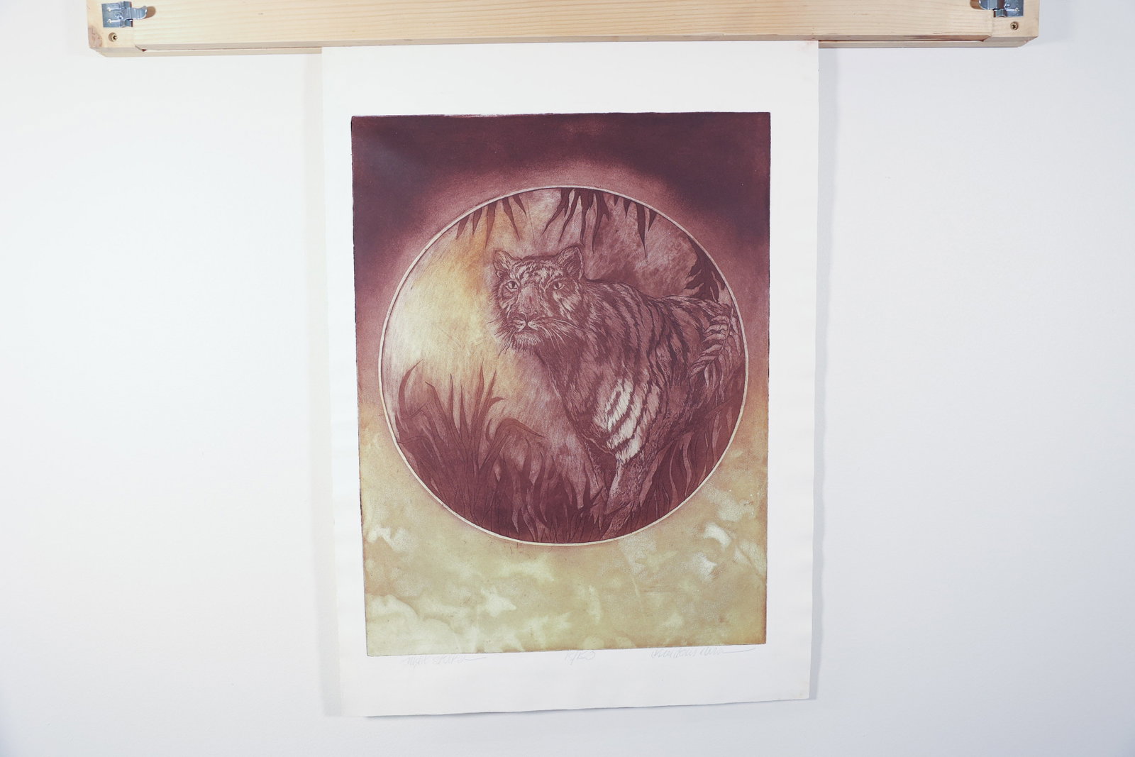 "Night Stalker" Tiger Etching, Carol Davis Elvin: Limited edition etching titled "Night Stalker" by Carol Davis Elvin, depicting a tiger within a circular vignette framed by jungle foliage, printed in warm sepia and burgundy tones with visible plate 