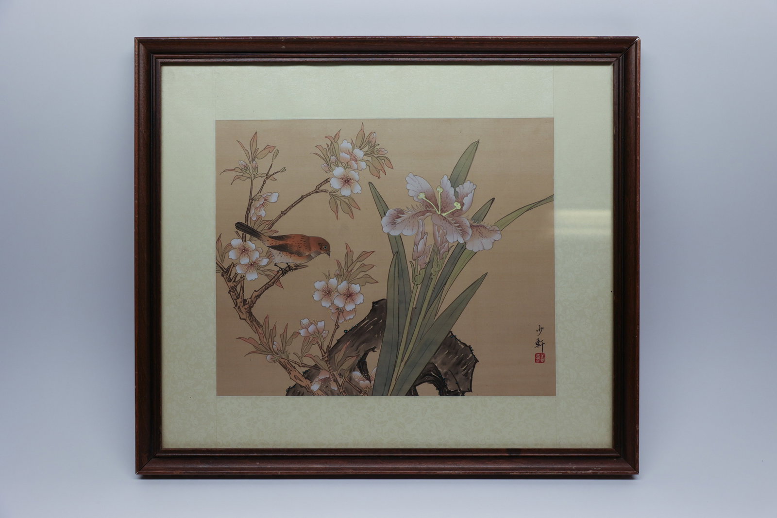 Chinese Bird & Flower Painting, Signed, Framed: Description:A gouache and watercolor painting on silk depicting a songbird perched on a flowering branch beside blooming iris and weathered rockwork, executed in the gongbi (fine-line) tradition with 