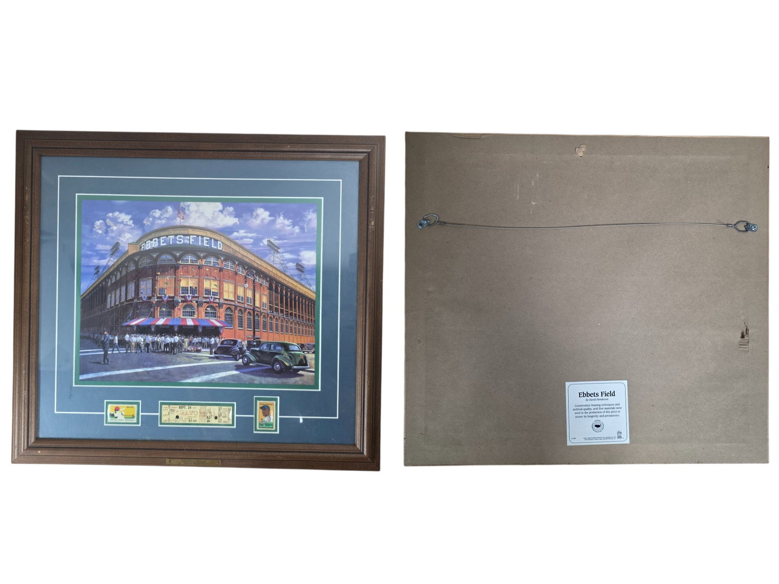 FRAMED BROOKLYN DODGERS EBBETS FIELD PRINT BY DAVID HENDERSON W/ STUB & STAMPS: This nostalgic sports memorabilia piece features a beautifully framed print of the iconic Ebbets Field by artist David Henderson. Celebrating the beloved Brooklyn Dodgers, the display is elegantly acc