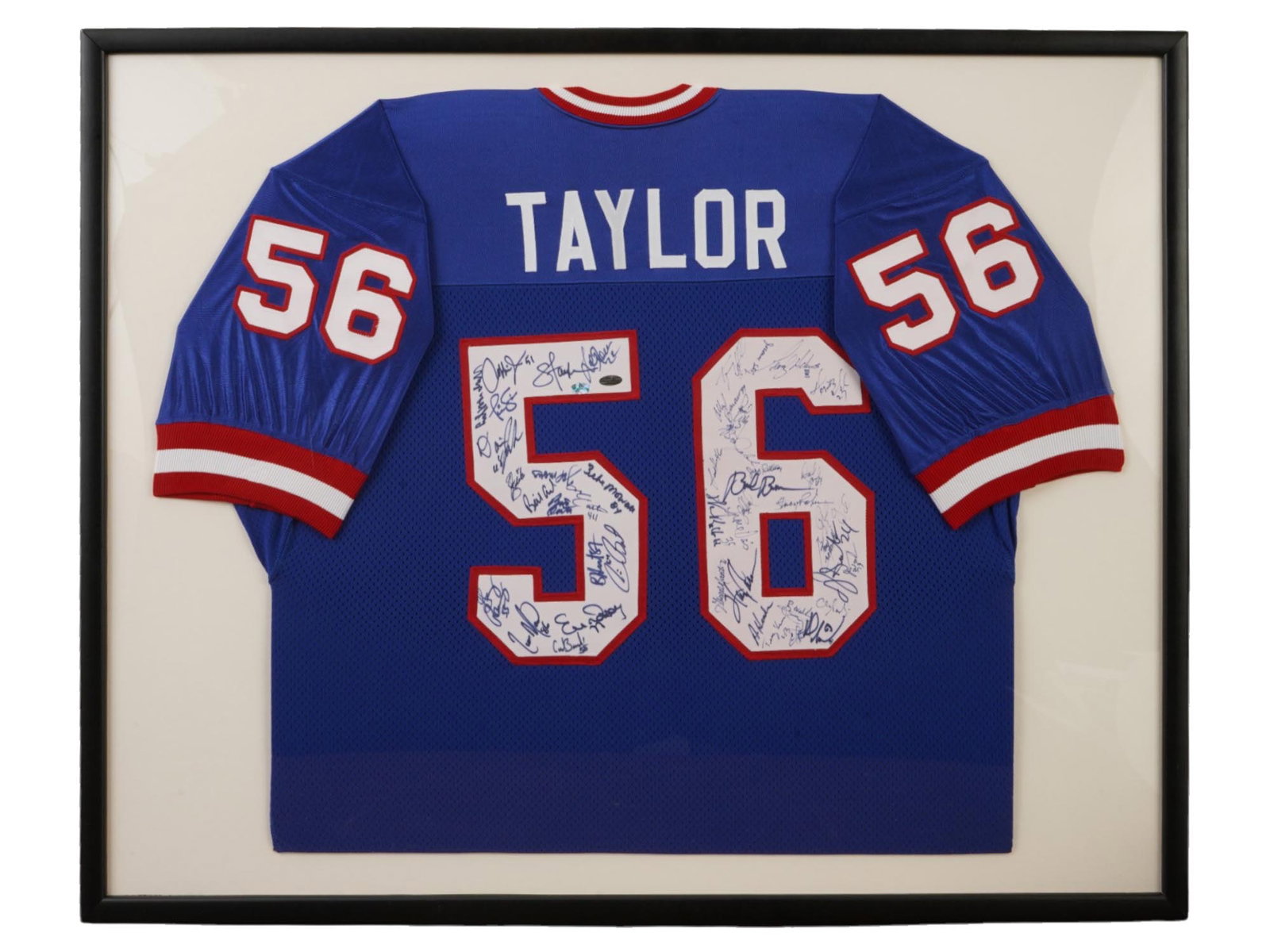 1986 NY GIANTS TEAM SIGNED LAWRENCE TAYLOR JERSEY: This professionally framed 1986 New York Giants jersey is hand-signed by the championship team, including Hall of Famer Lawrence Taylor. Authenticated by Fameabilia, this piece commemorates the