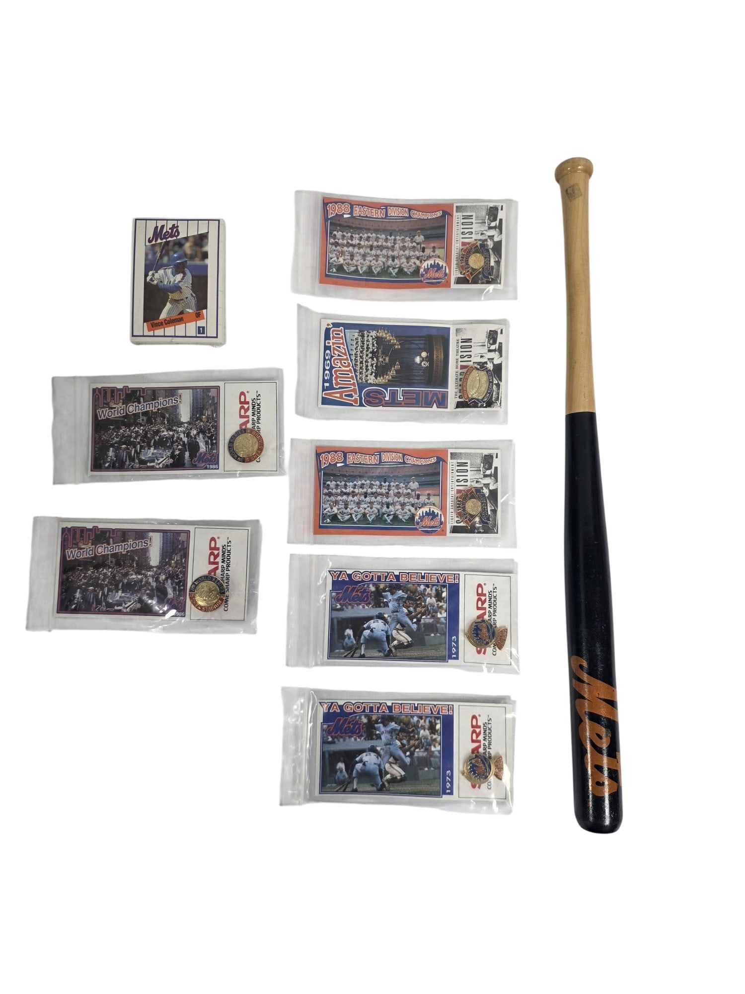 LOT OF NEW YORK METS SOUVENIR ITEMS: This expansive sports memorabilia lot is packed with an assortment of vintage and modern New York Mets souvenir items. Featuring a curated mix of mini bats, collectible pins, and trading cards, this l