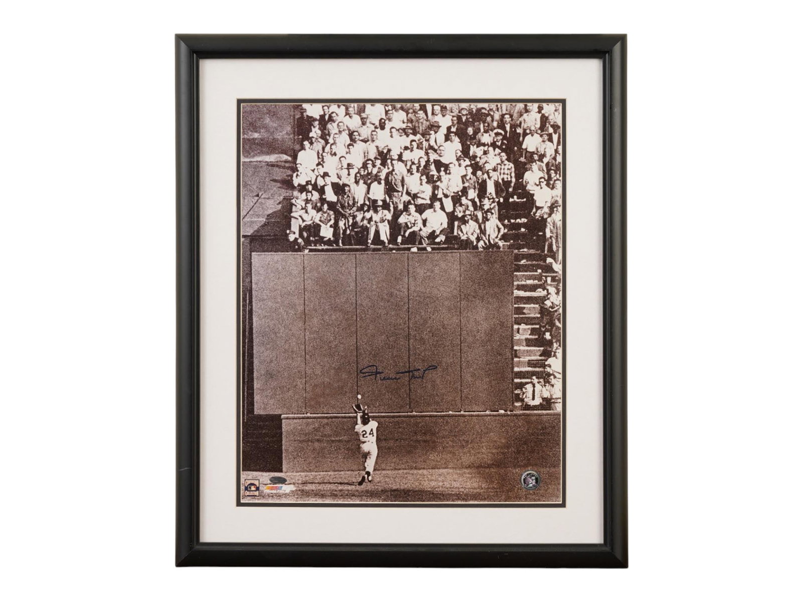 WILLIE MAYS SIGNED 1954 WORLD SERIES THE CATCH FRAMED PHOTO: This iconic black and white photograph captures Willie Mays making "The Catch" during Game 1 of the 1954 World Series, widely considered one of the greatest defensive plays in baseball history. The im