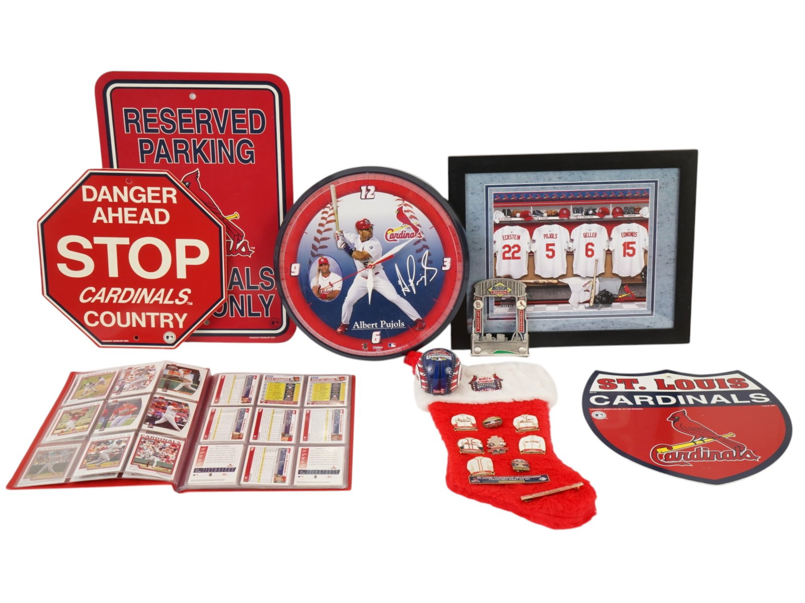 COLLECTION OF ST LOUIS CARDINALS BASEBALL MEMORABILIA: A collection of St. Louis Cardinals baseball memorabilia includes a variety of decorative and collectible items celebrating the franchises history. Featured prominently is a wall clock depicting Alber