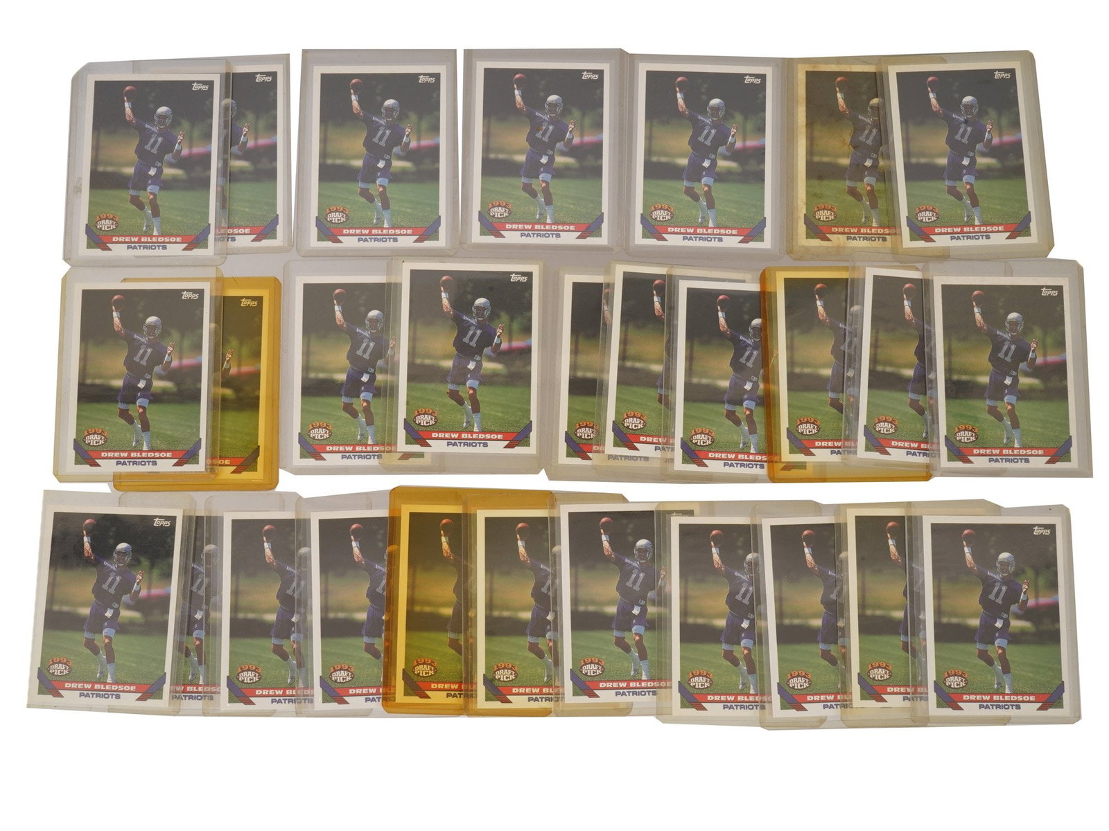 COLLECTION OF 1993 DREW BLEDSOE TOPPS FOOTBALL SPORT CARDS: A collection of 1993 Drew Bledsoe football sport cards, primarily from his early career with the New England Patriots. Housed in plastic protectors. Vintage American Trading Cards And Sports