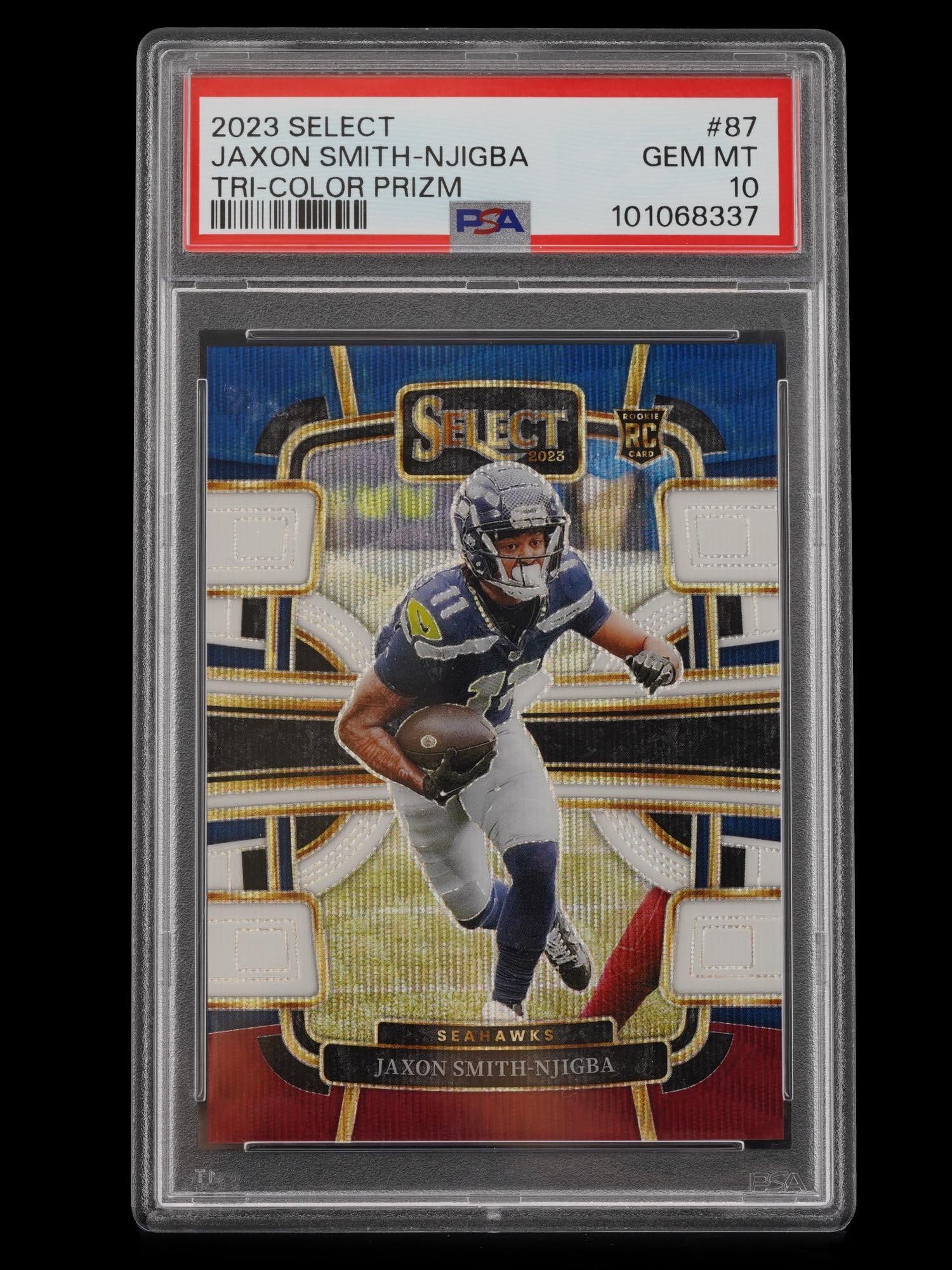 2023 PANINI SELECT TRI-COLOR PRIZM SMITH-NJIGBA PSA 10: This exceptional 2023 Panini Select rookie card features Seattle Seahawks wide receiver Jaxon Smith-Njigba in the highly coveted Tri-Color Prizm parallel. Professionally graded as a PSA 10 Gem Mint, t
