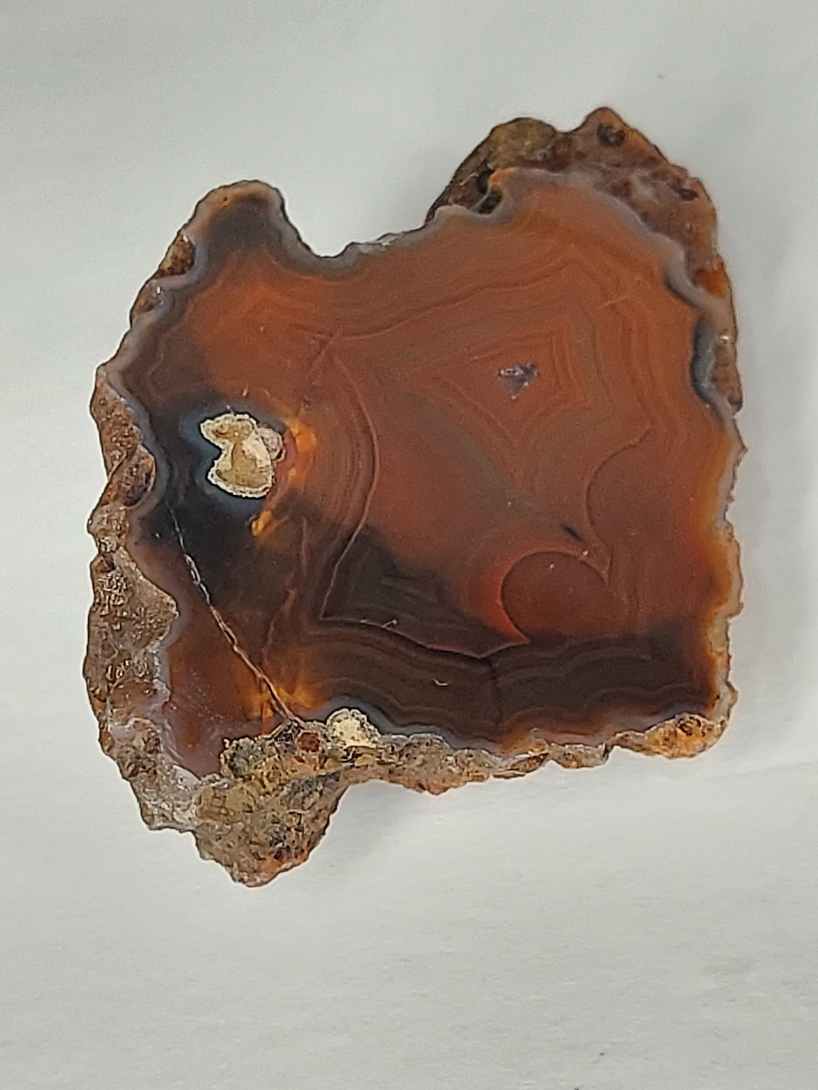 Banded Agate: Banded Agate Face-Polished Chunk This natural banded agate features a beautifully face-polished surface showcasing intricate fortification banding in rich shades of deep reddish-brown, mahogany,