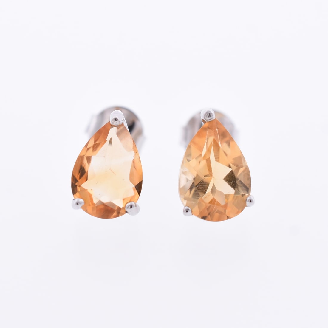 Pear Citrine Stud Earrings: Sterling Silver | Approximate Dimensions: 1/4" W x 3/8" T | Approximate Weight: 2.0g | Stones have been verified to be natural.