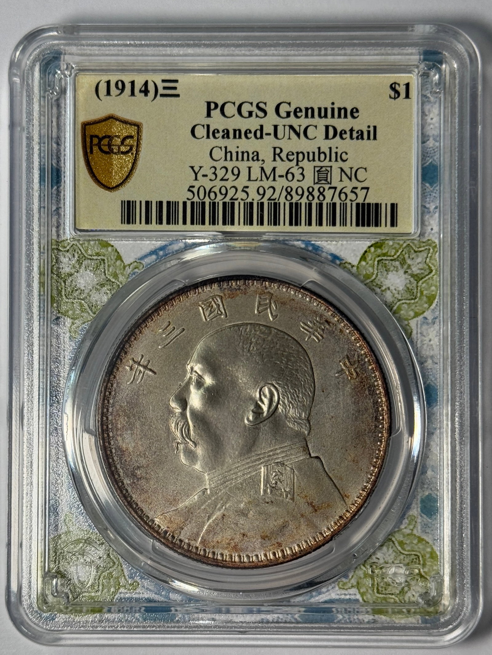 (1914) PCGS Genuine Cleaned-UNC Detail China, Republic Y-329 LM-63 NC: Republic of China Year 3 (1914) Yuan Shikai silver dollar, Yuan NC variety. PCGS Genuine Cleaned-UNC Detail, Y-329 LM-63 NC. Cert. 506925.92/89887657. Cleaned; UNC-level detail.