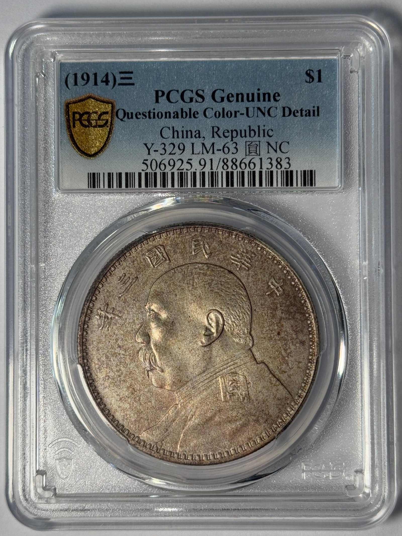 (1914) PCGS Genuine Questionable Color-UNC Detail China, Republic Y-329 LM-63 NC: Republic of China Year 3 (1914) Yuan Shikai silver dollar, Yuan NC variety. PCGS Genuine Questionable Color-UNC Detail, Y-329 LM-63 NC. Cert. 506925.91/88661383. Questionable toning/color; UNC detail.