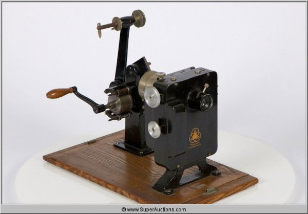 Krupp Ernamann Hand Crank 35 mm Projector: Krupp Ernamann / Ganz & Co. Hand Crank 35 mm Projector / Black Mounted on Wood Stand / L 9 1/2" x W 9 3/4 x H 13"