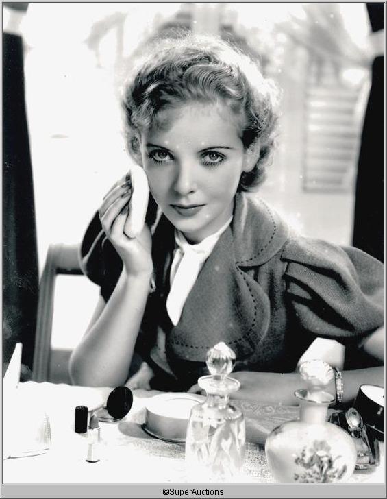 Ida Lupino Photographs: Ida Lupino from The Max Factor Collection / (2) 8 x 10 Black & White Photographs of Ida Lupino Applying Face Powder Make-Up