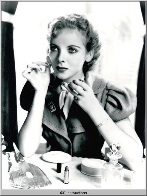Ida Lupino Negative and Photographs: Ida Lupino from The Max Factor Collection / (1) 8 x 10 Negative of Ida Lupino Applying Rouge Make-Up / (2) 8 x 10 Black & White Photographs