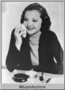 Sylvia Sidney Negative: Sylvia Sidney from The Max Factor Collection / (1) 8 x 10 Nitrate Negative of Sylvia Sidney Applying Face Powder Make-Up