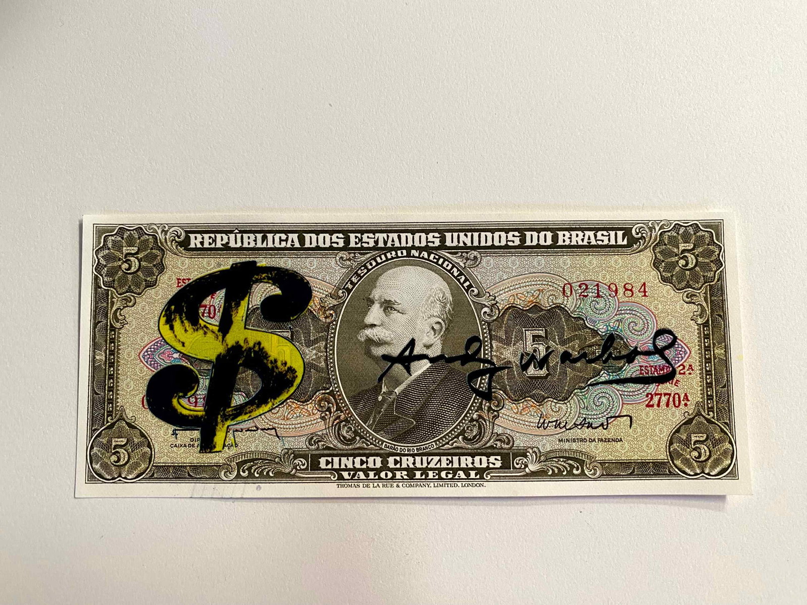 Andy Warhol ( AFTER) silkscreen on banknotes: "AFTER" Andy WarholTitle: Screen-printed banknote "AFTER" Andy Warhol Media: 5 Cruzeiros Brazilian banknote Description: Screen-printed banknote of a work by Andy Warhol. The back features a postmark 