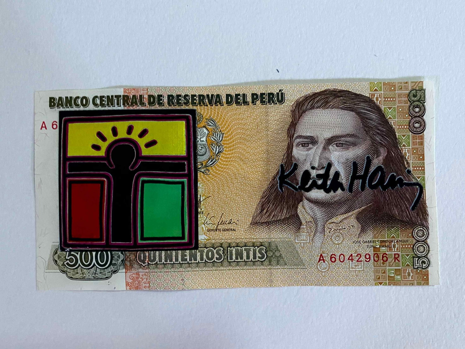 Keith Haring ( AFTER) silkscreen on banknotes: "AFTER" Keith Haring Title: Silkscreened Banknote "AFTER" Keith Haring Material: 500 Reserva Central del Peru Banknote Description: Silkscreened banknote of a work by Keith Haring. The back features a