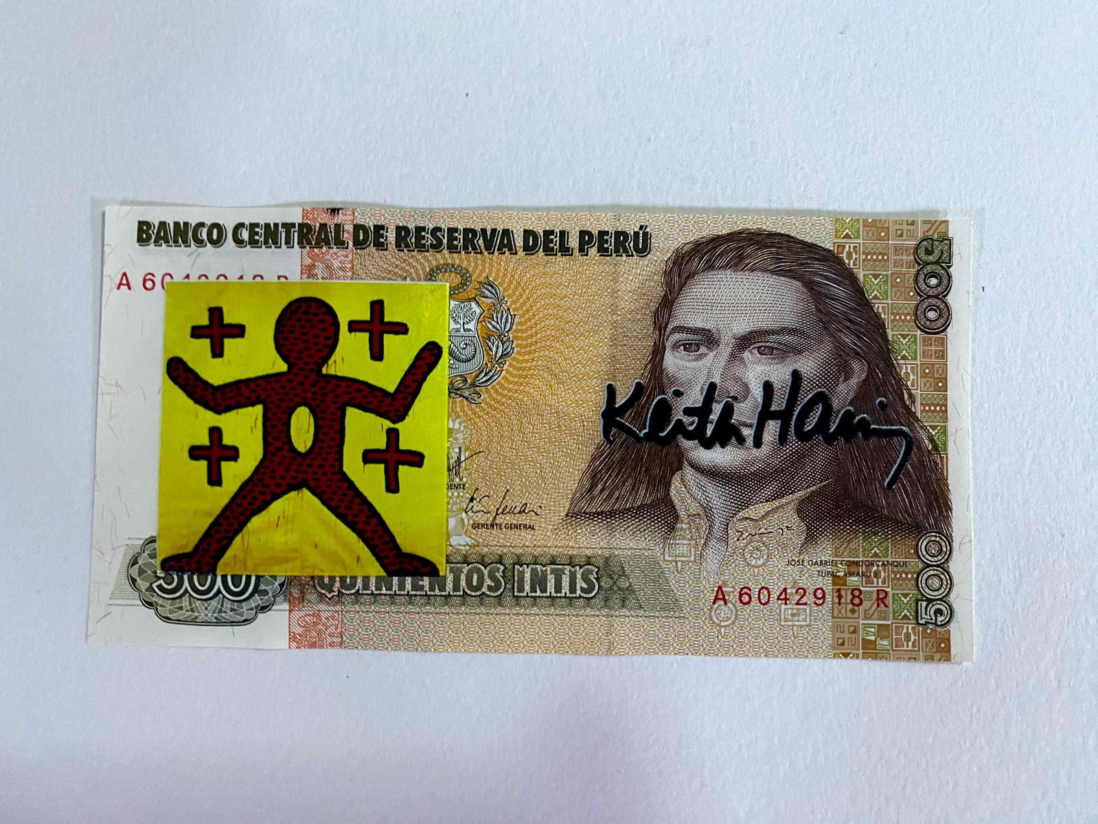 Keith Haring ( AFTER) silkscreen on banknotes: "AFTER" Keith Haring Title: Silkscreened Banknote "AFTER" Keith Haring Material: 500 Reserva Central del Peru Banknote Description: Silkscreened banknote of a work by Keith Haring. The back features a