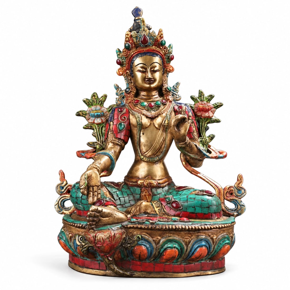 Nepalese-Style Inlaid Figure of Green Tara: A Nepalese-style figure of Green Tara, seated on a lotus base with her right leg extended and her right hand lowered in the gesture of generosity. The crowned figure is flanked by lotus flowers and el