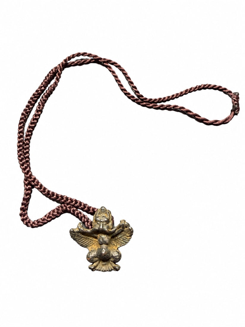 Yuan or Ming Dynasty, Tibetan Garuda Thokcha Protective Amulet: A Tibetan thokcha protective amulet depicting Garuda,Yuan–Ming period. Measuring approximately 3.81 × 3.81 cm, this compact pendant presents the bird deity in a powerful frontal pose with outspread