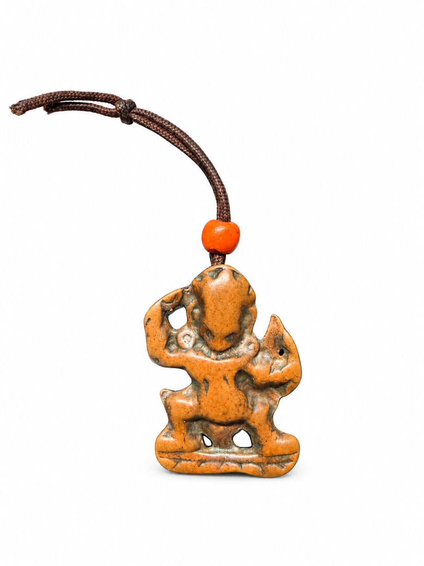 Qing Dynasty, Tibetan Thokcha Amulet, Possibly Depicting Achala: A Tibetan thokcha amulet, possibly depicting Achala, the Buddhist protector known as the Immovable One. The compact figure has one arm raised and bent legs, with open spaces around the limbs and above