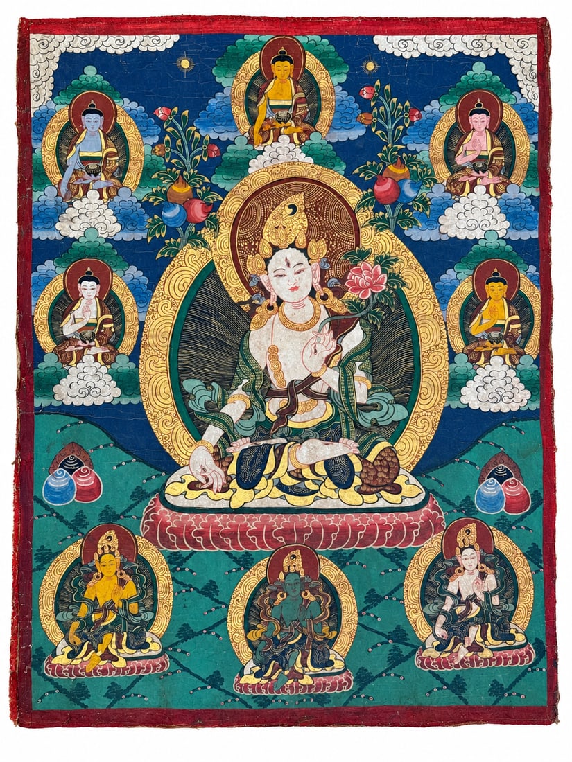 Rare Qing Dynasty, Tibetan White Tara Thangka with Red Handprints on Reverse: A Tibetan thangka of White Tara, the Qing dynasty. The seven-eyed goddess is seated on a lotus throne, holding a flowering lotus and framed by an elaborate aureole with fine gold-colored ornament. Fiv