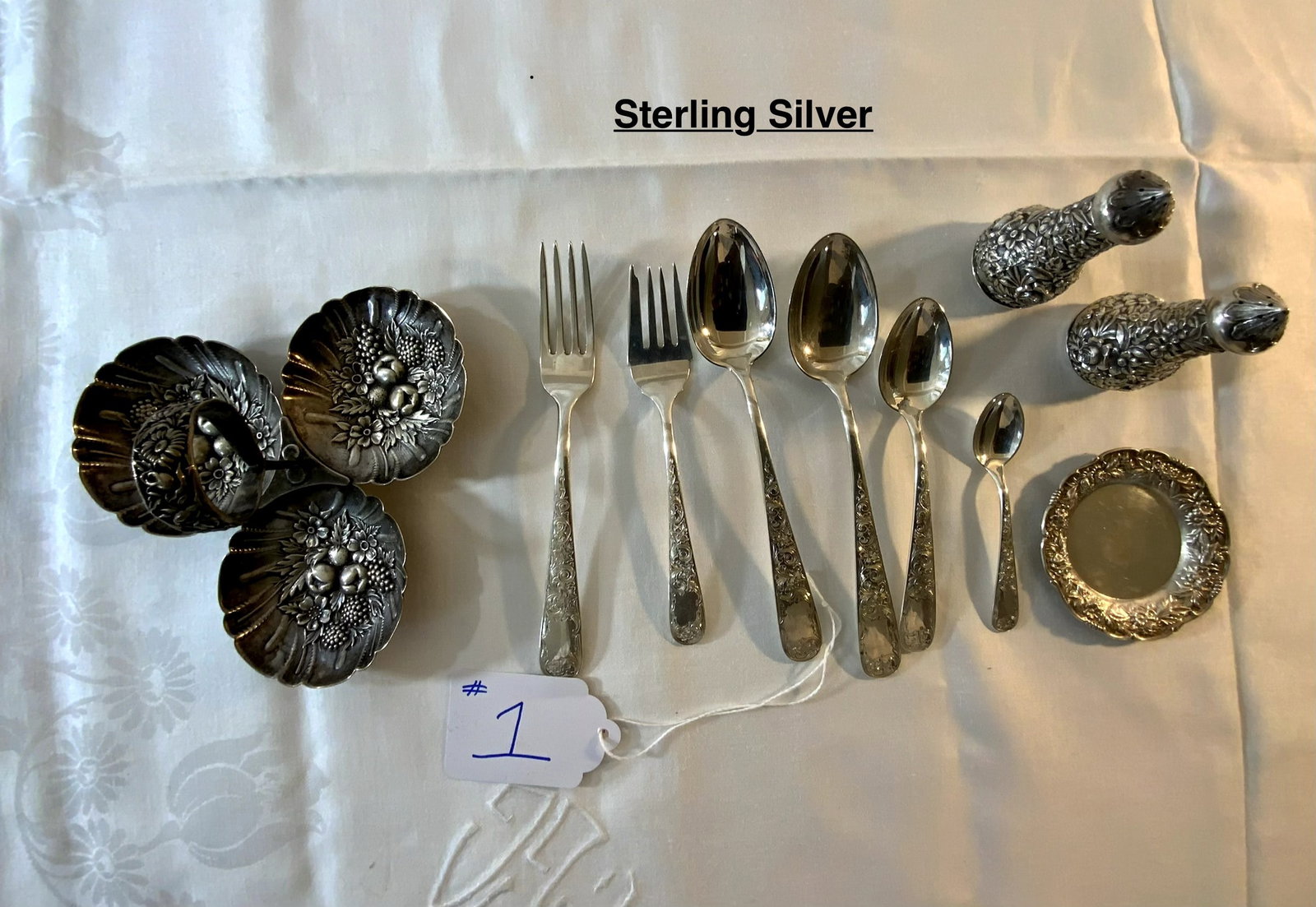 Sterling Kirk: Sterling Kirk, 18.335 oz t. S. Kirk & Son, 10 piece lot, salt and pepper shakers, repousse, three part open nut dish with center handle, butter, two forks, four spoons. Good condition.