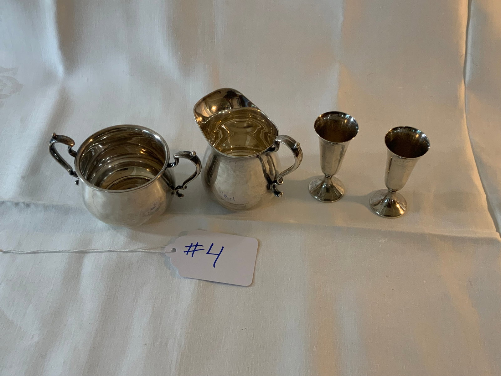 Fisher Sterling: Fisher Sterling, 6.730 oz t, four piece lot including sugar and creamer, and two cordials. Good condition.