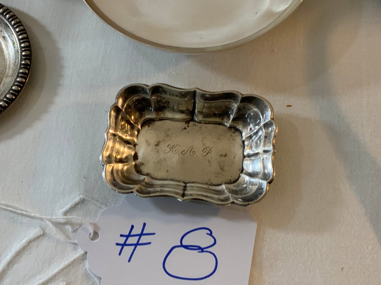 Sterling Lot: Sterling lot, 19.030 oz t, 10 piece lot including two sets of salt & pepper shakers, a child's cup with handle, a meat fork, a large serving spoon, an open dish 5 inches round, butter pat, and a nut d