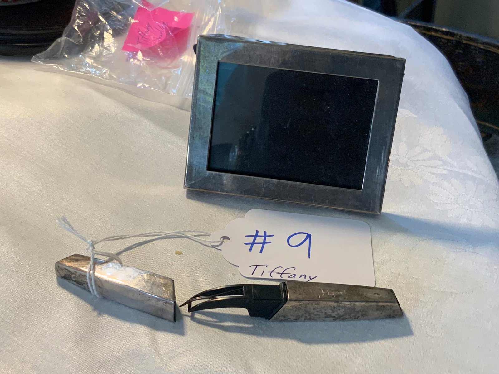 Tiffany Sterling: Tiffany Sterling photo frame, and small sewing item believed to be for threading a needle. Good condition.