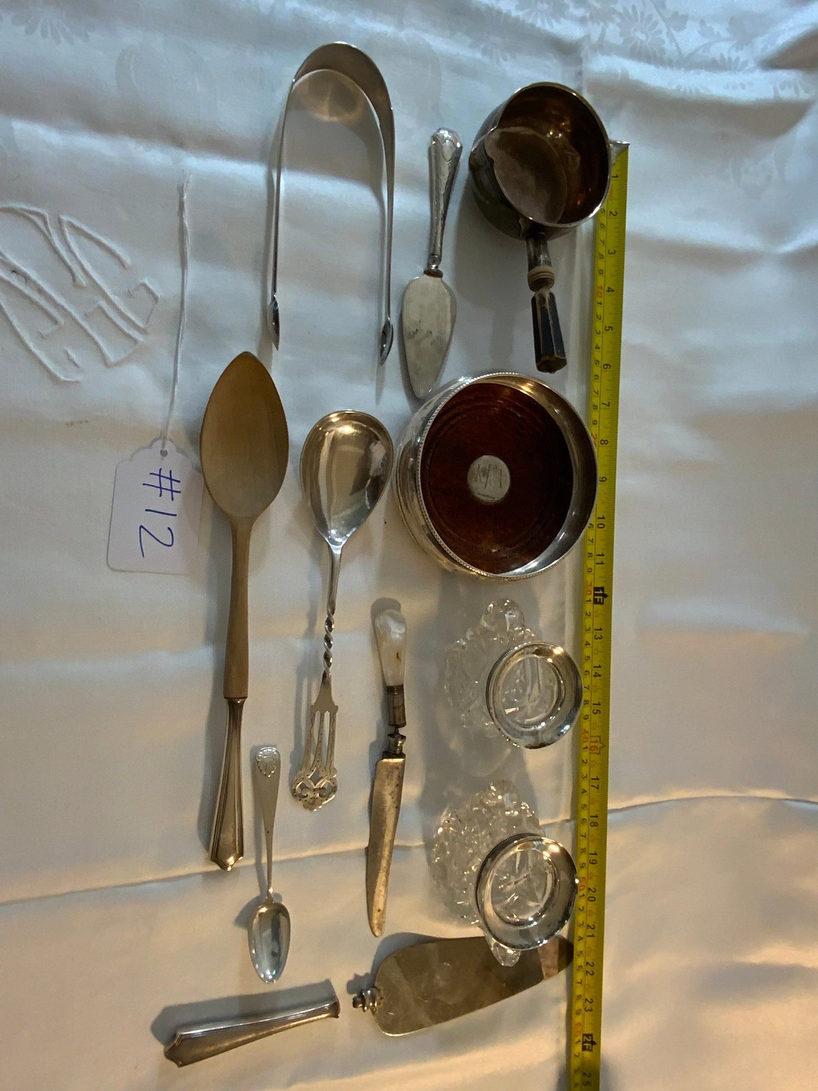 Sterling: Sterling, 11 pc lot of sterling items including wine caddy and other interesting serving pieces, spoons, tongs, cake servers, etc. Good condition.