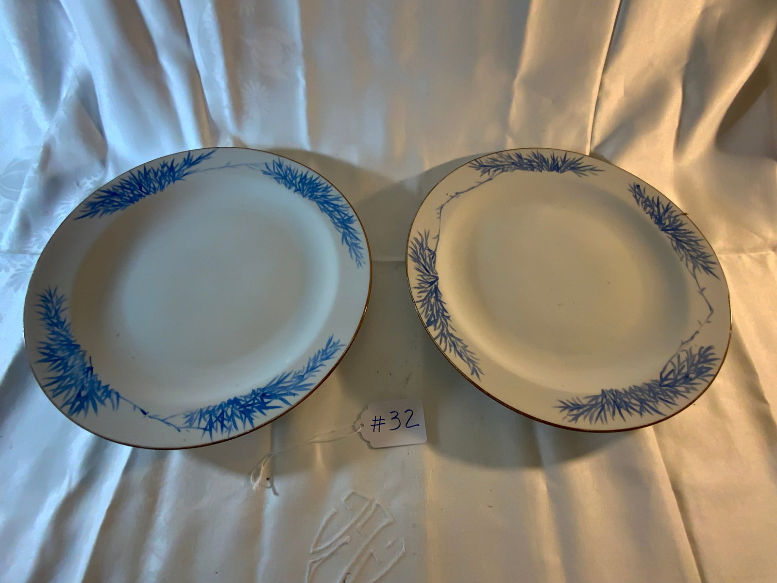Oriental Platters: Oriental pair of platters, white with blue decoration and gold trim on the edge, 14 1/2 inches. Good condition.