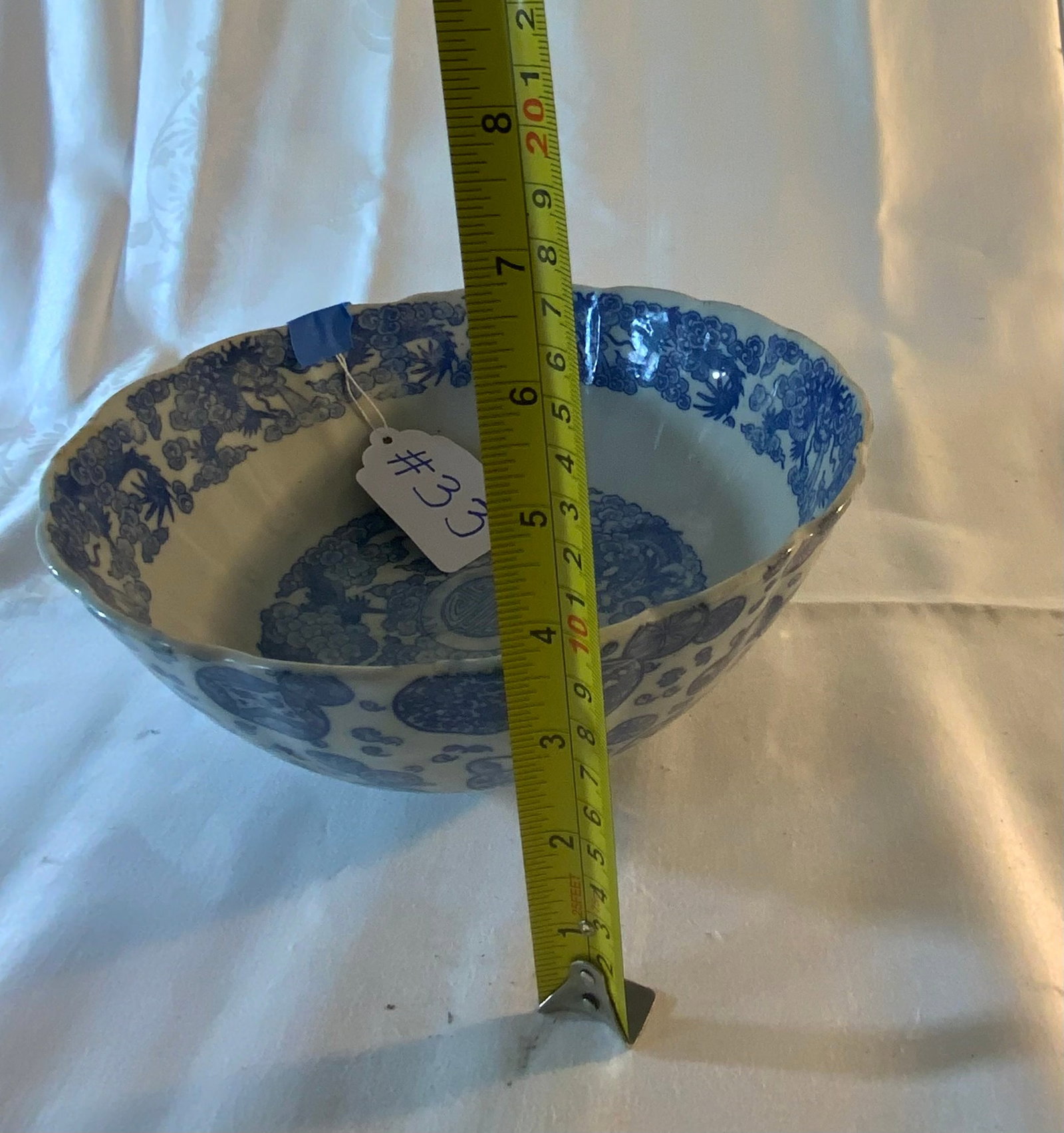 Oriental Bowl: Oriental bowl, white with blue decoration, 9 1/2 inches wide by 3 1/2 inches tall. Good condition.