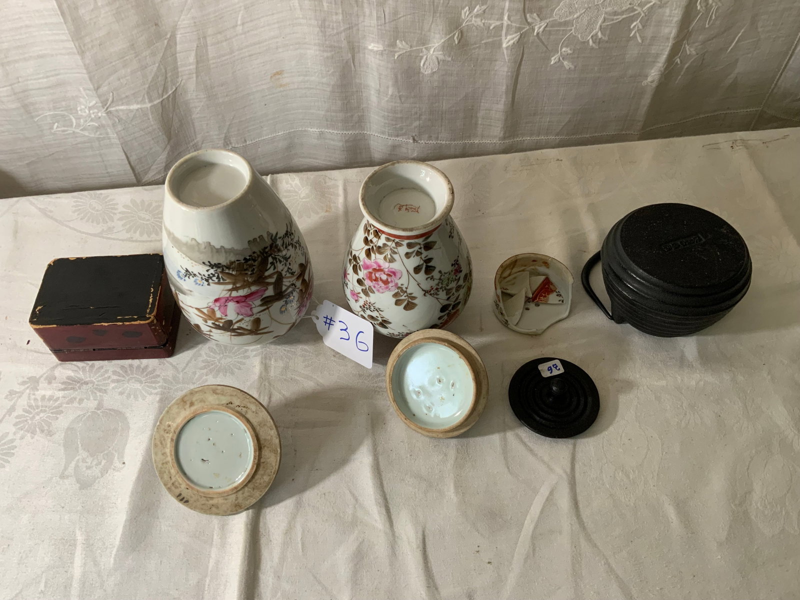Ginger Jars & Teapot: 2 ginger jars, 1 missing lid, other has damaged lid, 6 1/2 inches tall, 4 inches wide. Iron teapot, signed on the bottom, extra non-matching lids. Small hand-painted box. Teapot and two ginger jars
