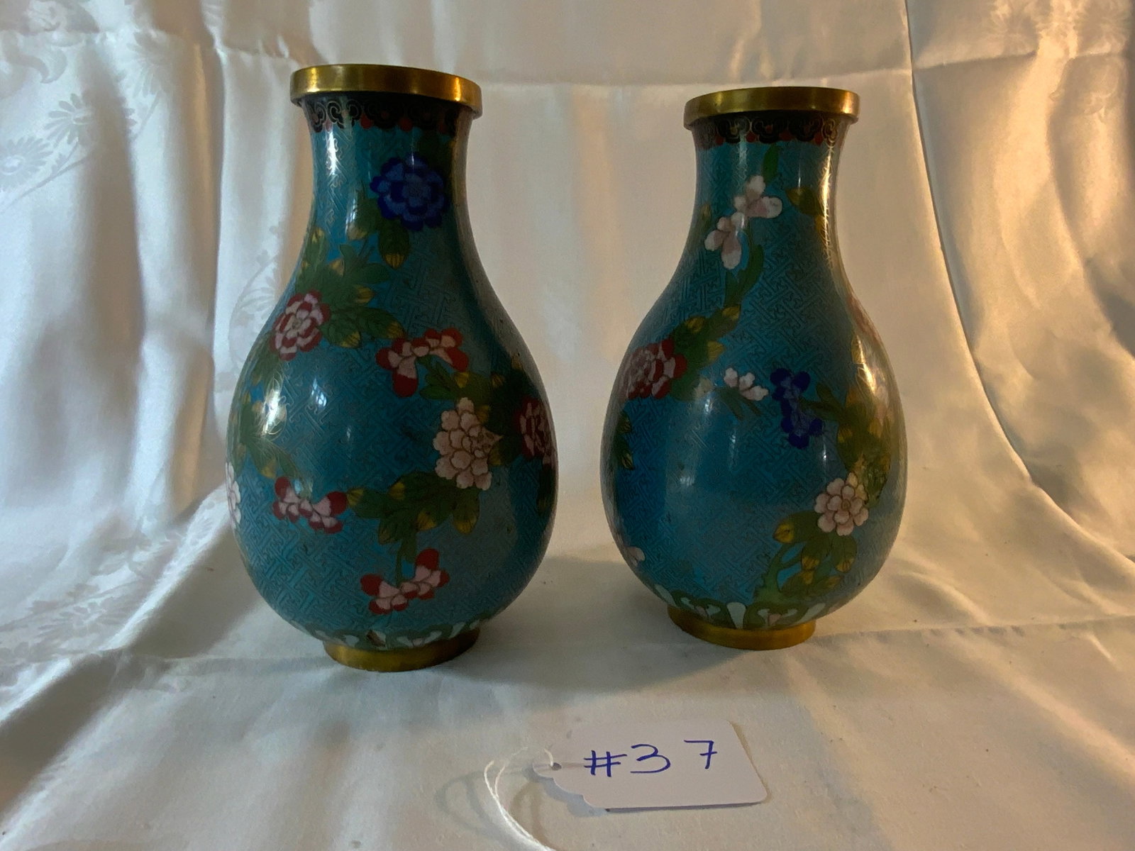Cloisonne Vases: Cloisonne vases, floral design, 5 inches wide, 9 inches tall. Good condition.