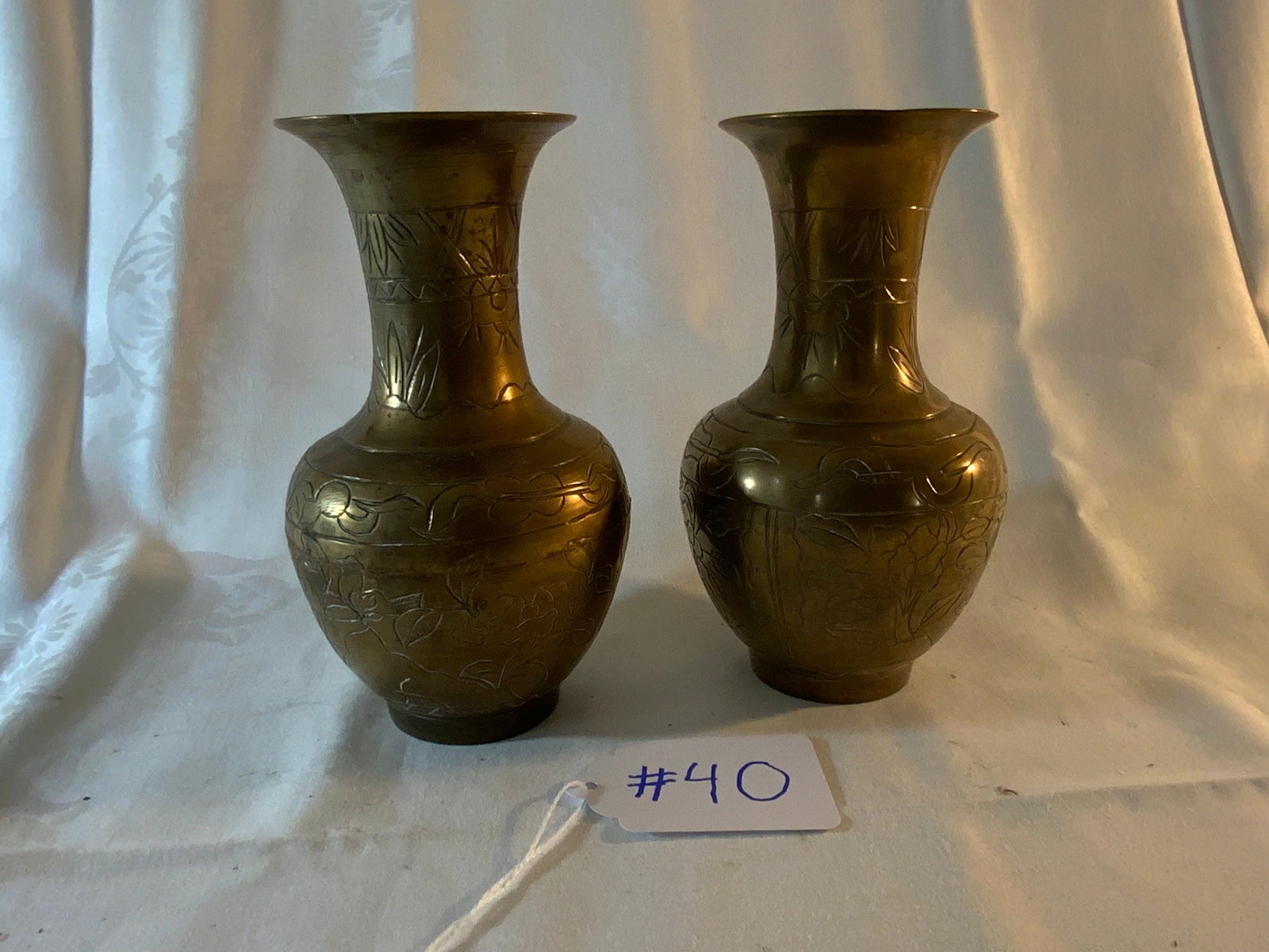 Oriental Brass Vases: Pair of oriental brass vases, floral design, 3 1/2" wide x 7" tall, signed on the bottom. Good condition.