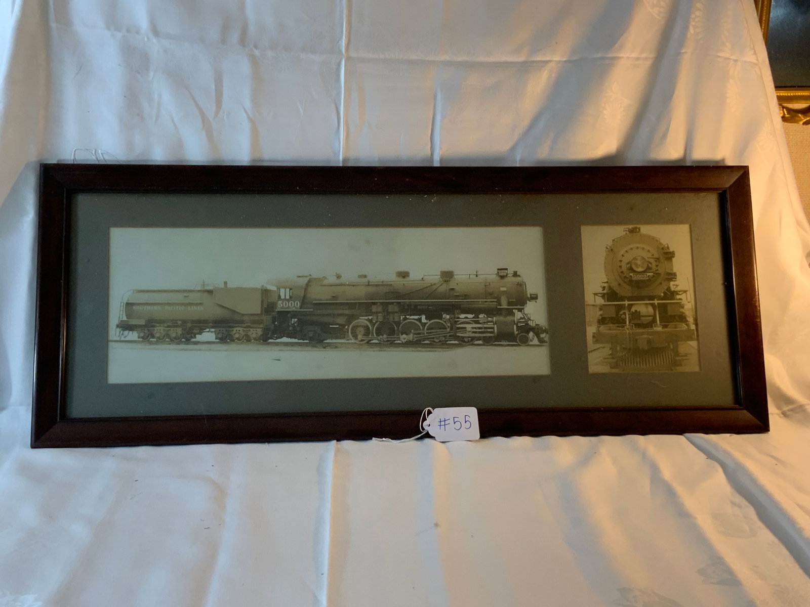 New York Central Locomotive Photograph: Photograph, New York Central locomotive number 5000 with coal car, framed and matted, 37" x 14". Good condition.