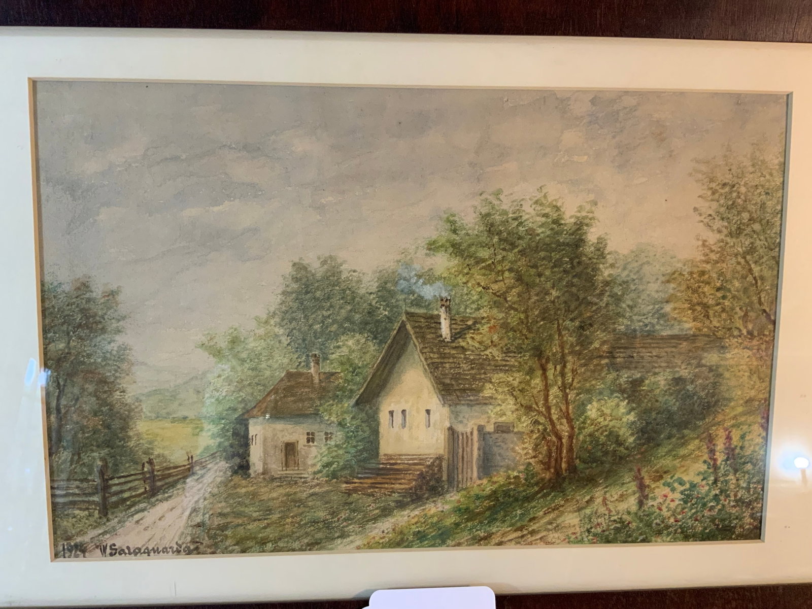 Watercolor of Two Cottages: Watercolor of 2 cottages, signed 1924 W. Saloguald (signature unclear), empire ogee frame, 13 inches wide, 8 inches tall. Good condition.