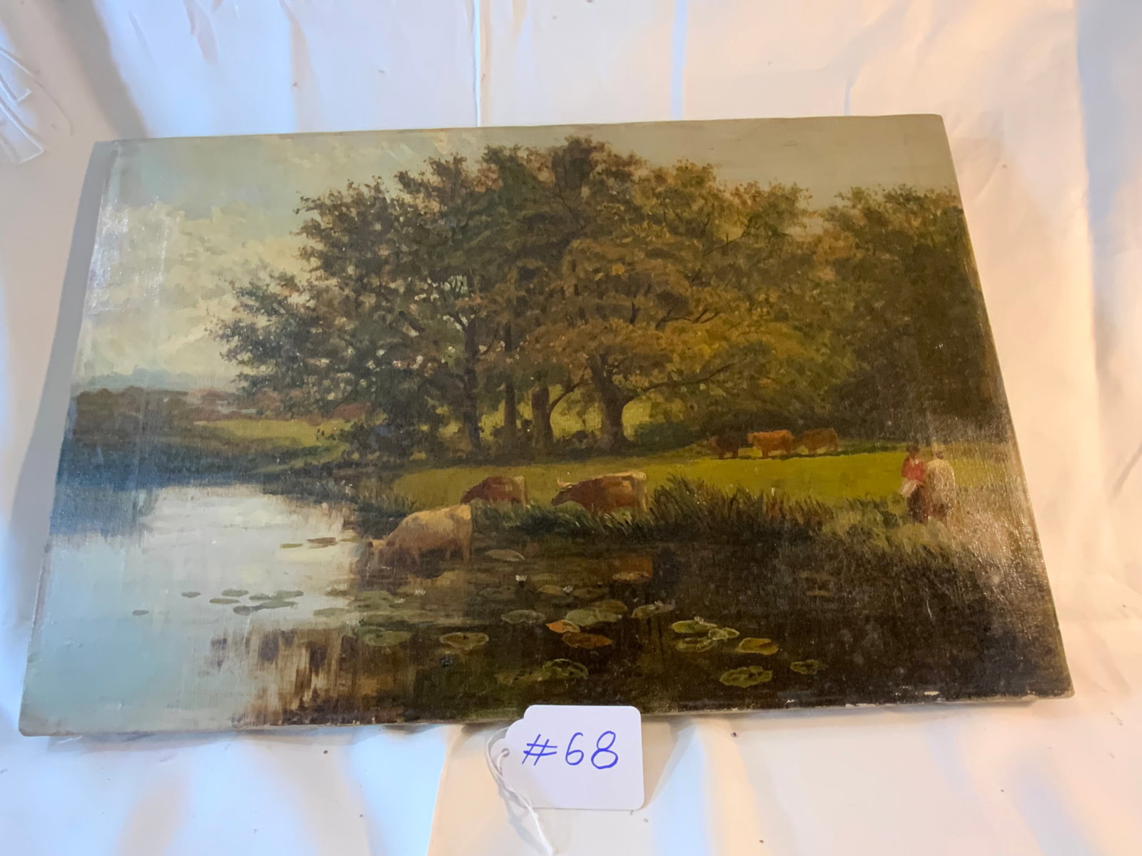 Possibly Richard Detreville Painting: Oil on canvas, possibly by Richard Detreville, cows/pond with trees, 2 people, unframed, 21" wide by 14 inches tall. Three small tape patches on backside. Fair condition.