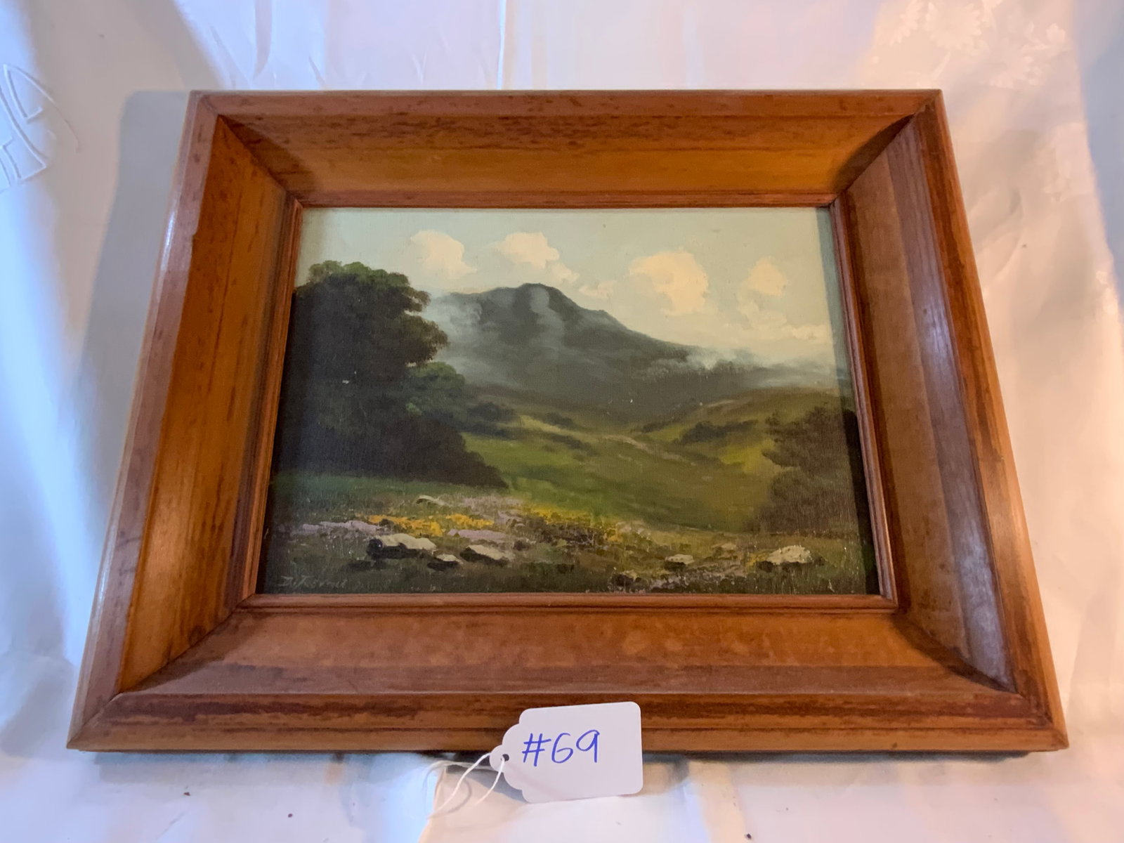 Possibly Richard Detreville Painting: Oil on canvas, possibly by Richard Detreville, landscape field valley w/ mountains in background, 14" wide x 10" tall, signed Detreville, in an early pine frame.
