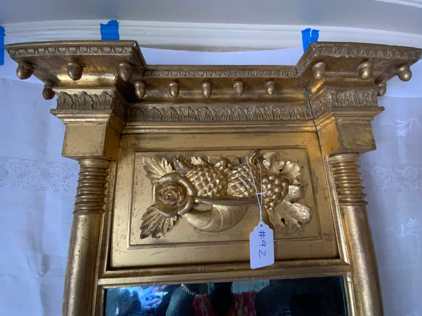 Federal Gold Gilt Mirror: Federal gold gilt mirror w/ 13 acorn drops (1 missing), cornucopia filled with fruit and flowers, 43" long x 25 1/2" wide.