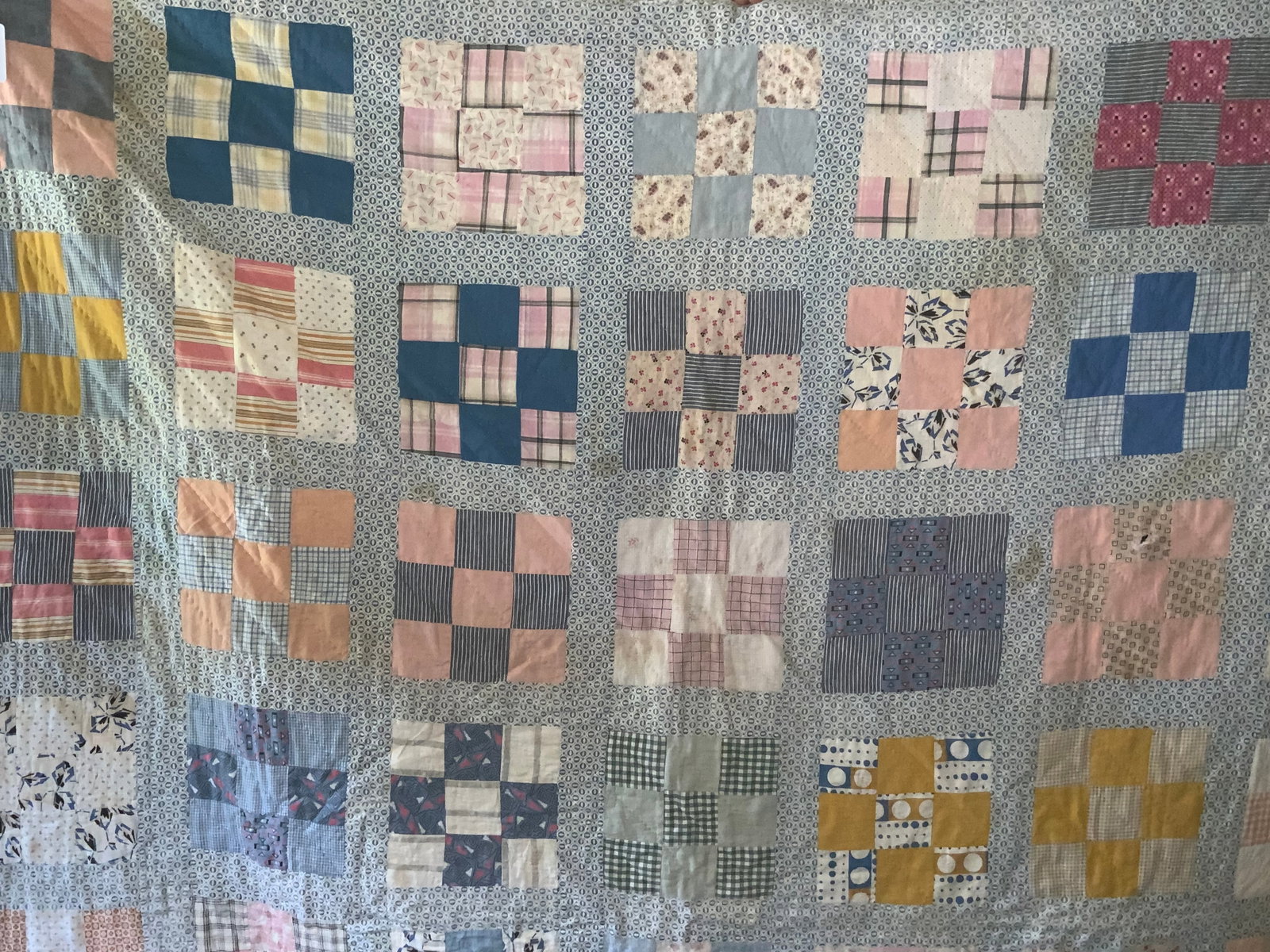 Amish Quilt: Amish quilt, blue w/ patchwork panels, 80" x 70", stains & quarter-size hole. Fair condition.