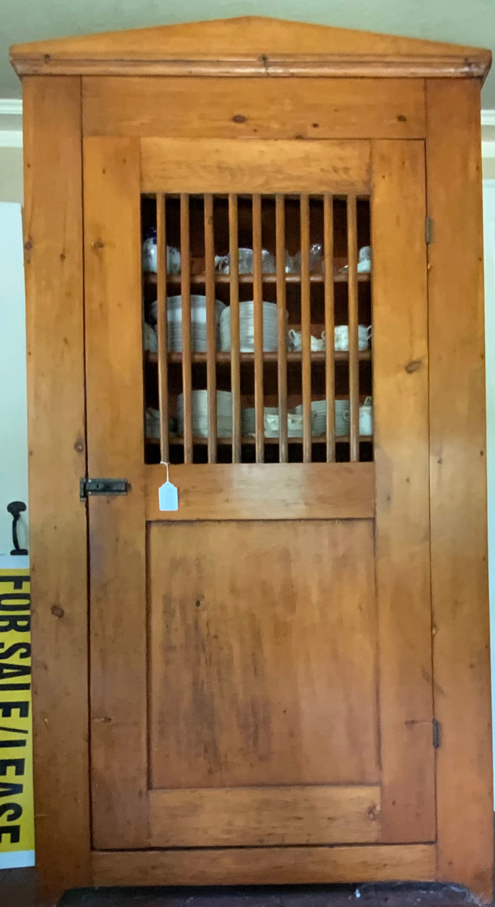 Pine Cupboard: Pine cupboard, Wisconsin, 19th century, made by Mennonites, spindle door, raised lower panel, 7 shelves inside, 46" wide, 50" tall, 17 1/2" deep, old finish. Good condition.