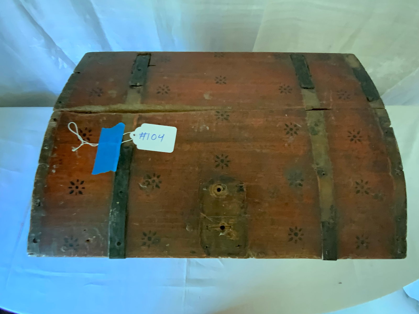 Immigrant's Trunk: Small red immigrant's trunk, probably Scandinavia, early 19th century, hinged domed top, metal strapped and reinforced corners, part of straps missing, normal paint loss, dated inside lid 1891, 22