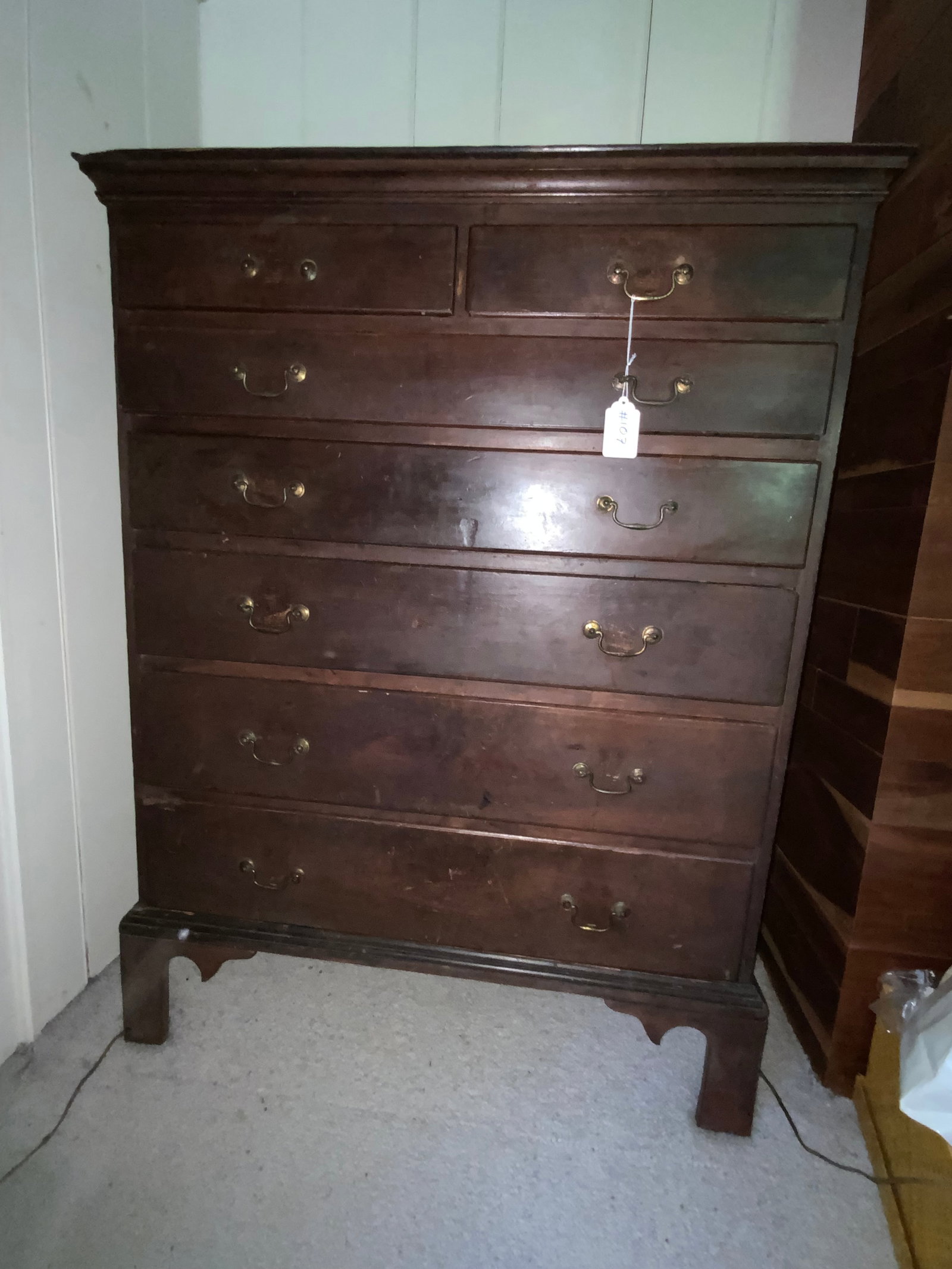 Butternut Chest: Butternut chest on bracket base, 7-drawer chest (2 small drawers over 5 graduated drawers), dovetail drawers, old finish and old hardware. Good condition.