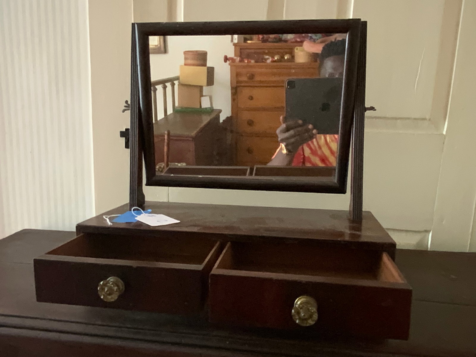 Shaving Mirror: Shaving mirror w/ 2 drawers on ball feet, brass hardware, 16" wide & deep, 16" tall, chip of wood lower left. Fair condition.