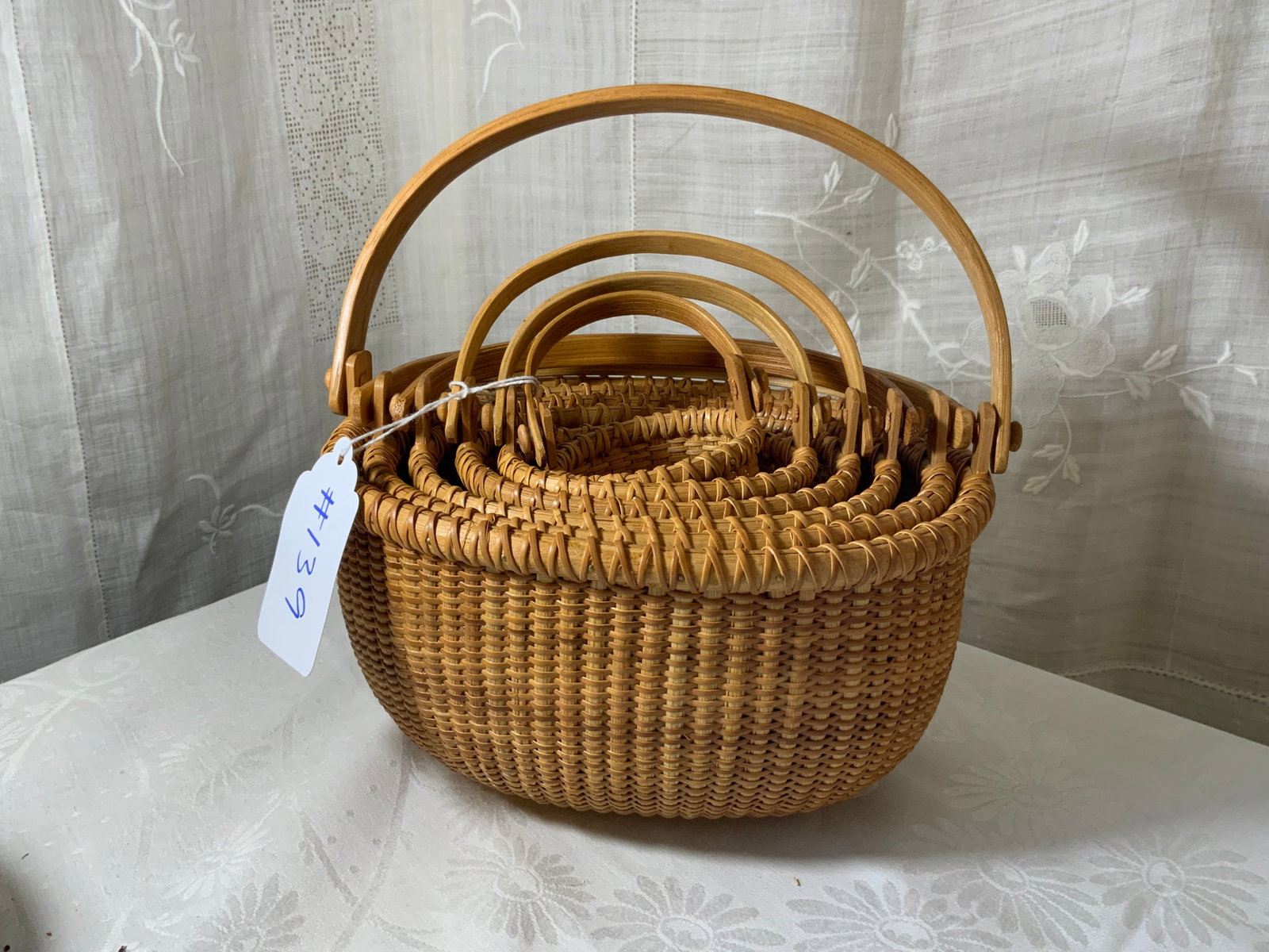 Nesting Nantucket Baskets: Nesting set of 6 Nantucket baskets, swing handles, not antique but high-quality. Good condition.