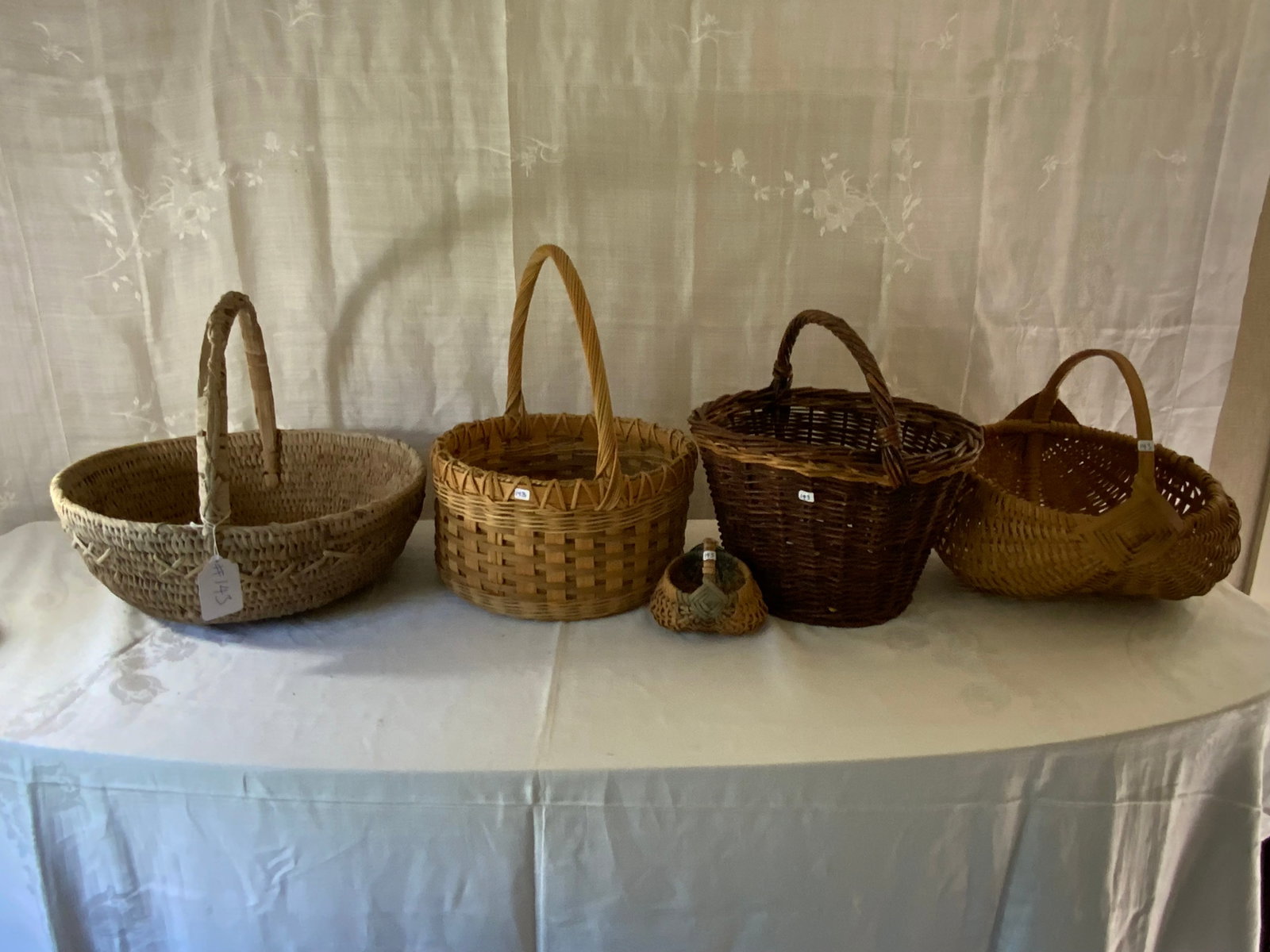 Gathering Baskets: Grouping of 5 handled gathering baskets, variety of ages, some minor damage.