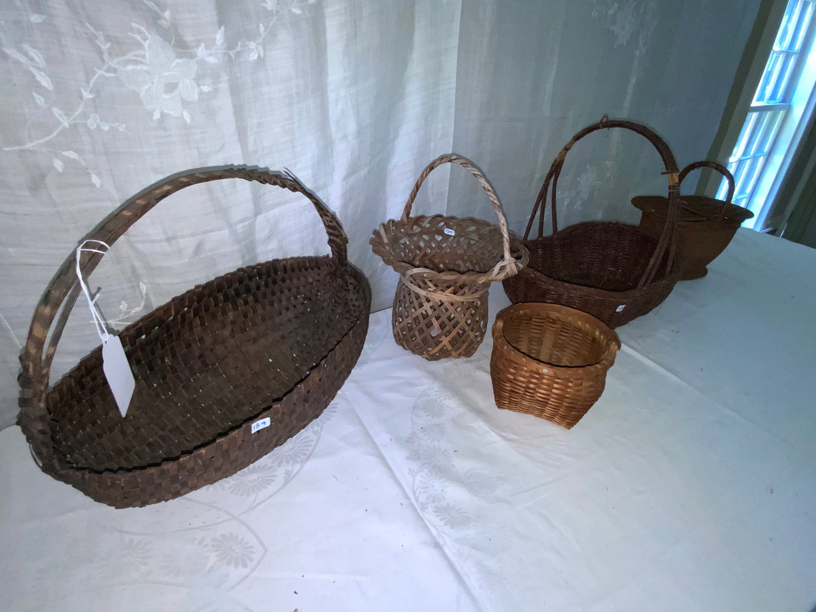 Baskets: Grouping of 5 handled baskets, early, some condition issues. Fair condition.